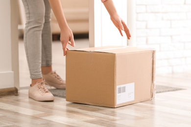 Photo of Woman taking parcel, closeup view. Delivery service