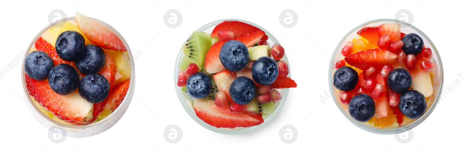 Image of Set of delicious fruit salads in glasses isolated on white, top view