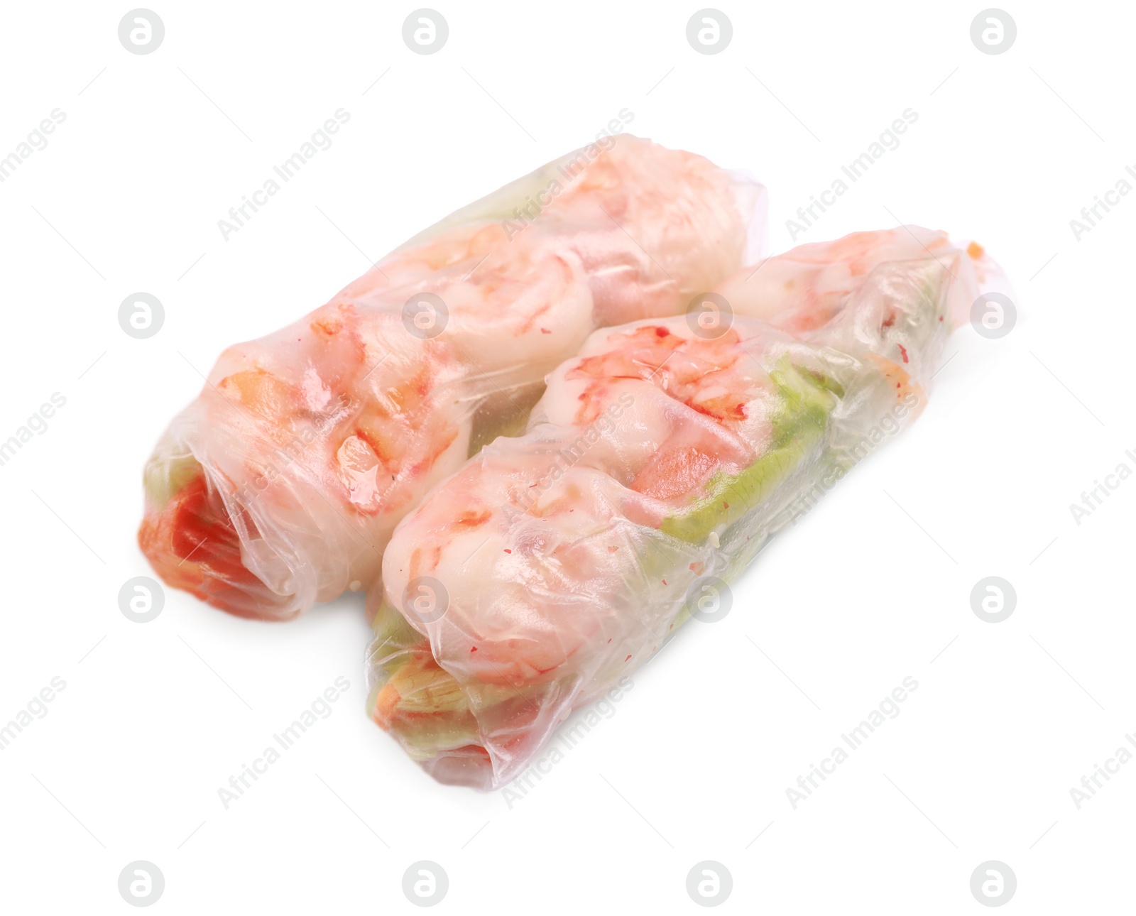 Photo of Tasty spring rolls with shrimps, carrot and lettuce on white background