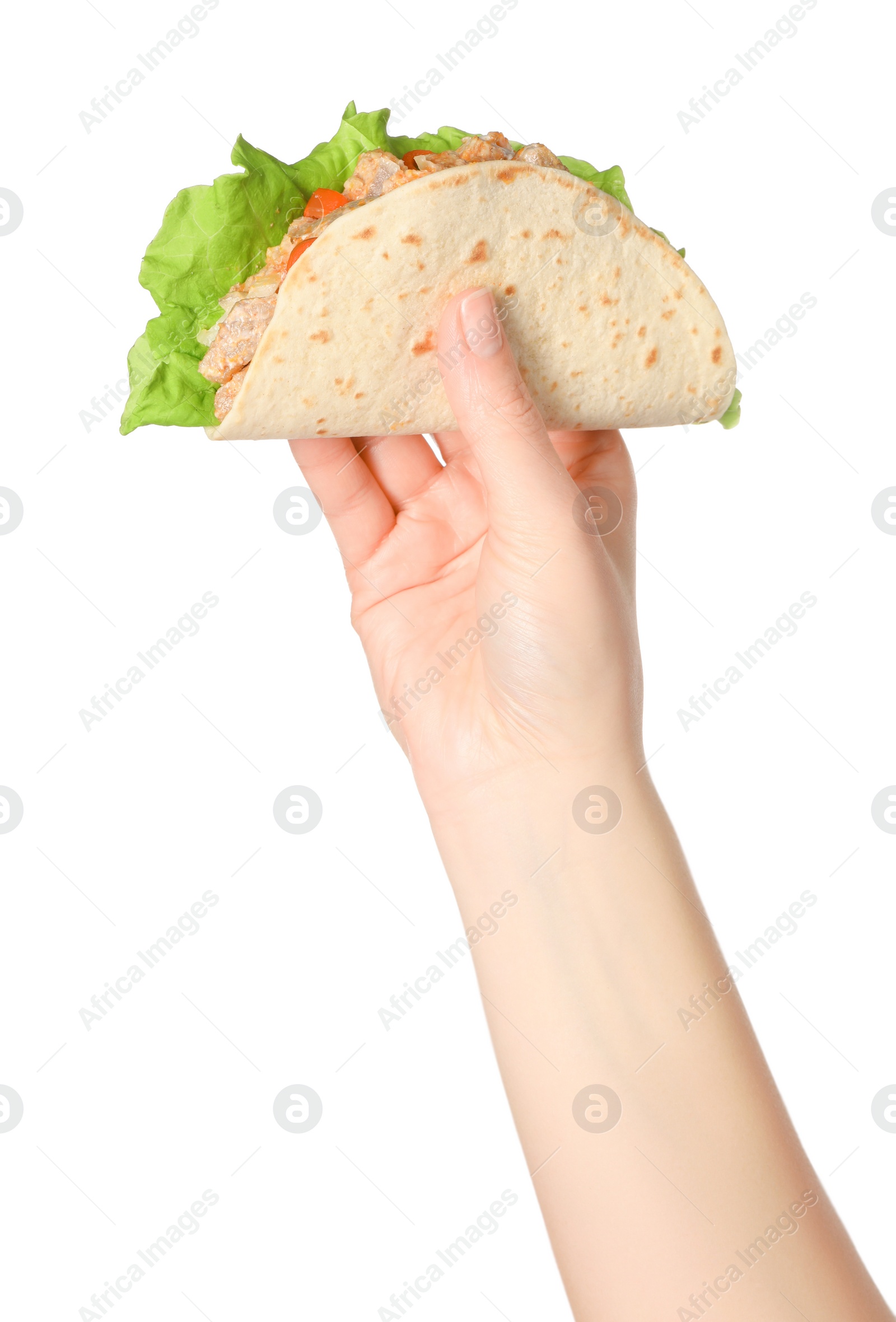 Photo of Woman holding delicious taco with meat and vegetables on white background, closeup