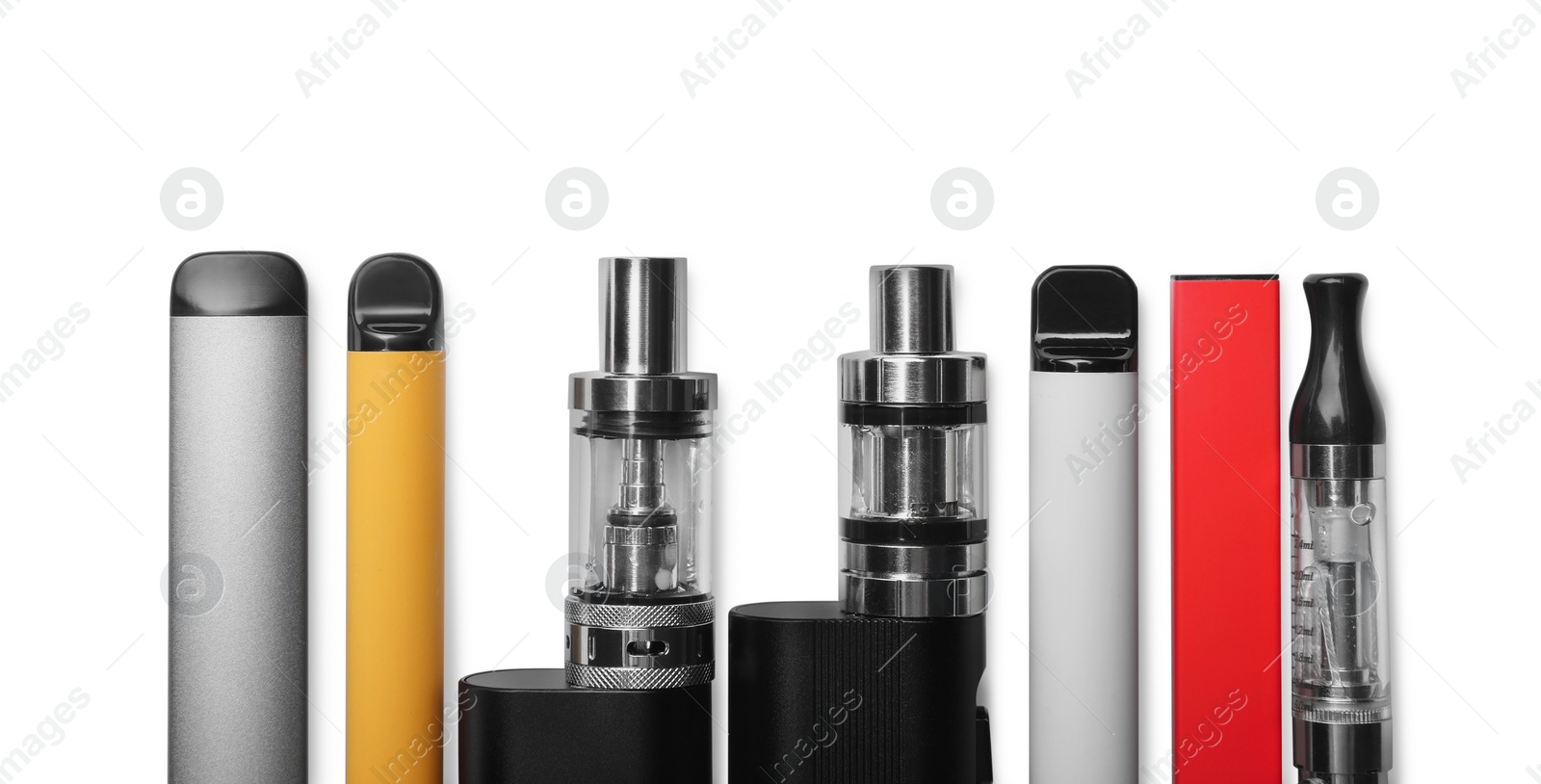 Photo of Different electronic cigarettes on white background, top view