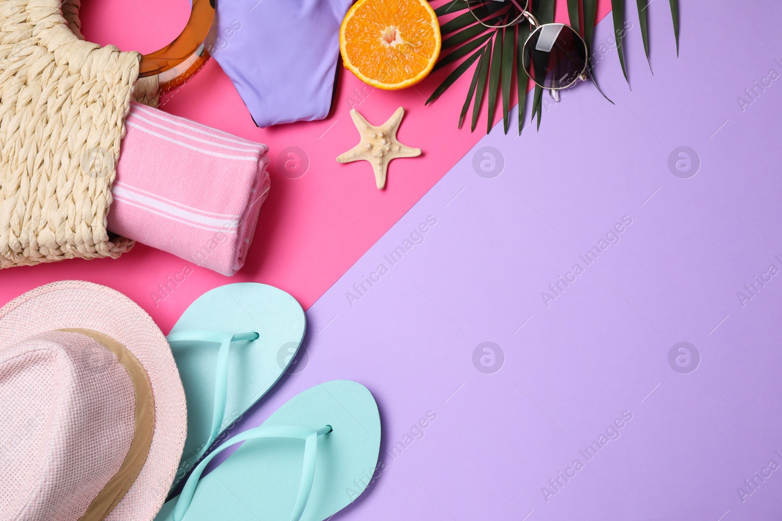 Photo of Flat lay composition with beach objects on color background. Space for text