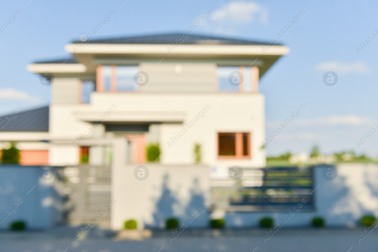 Photo of Blurred view of modern house on sunny day