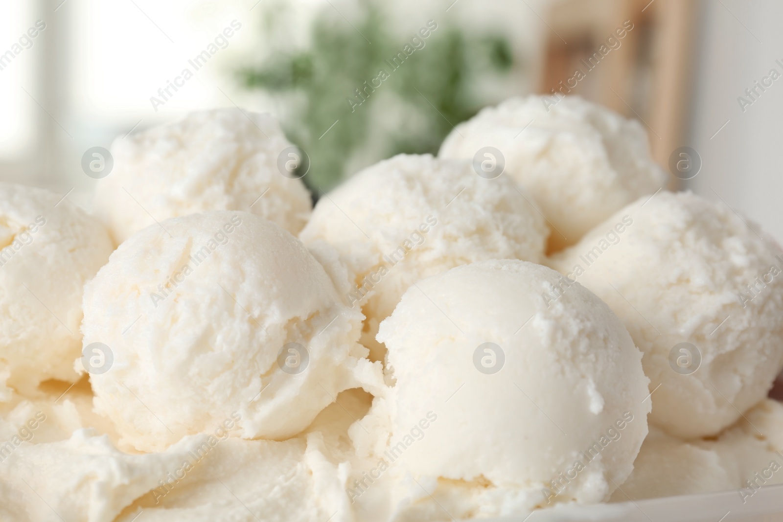 Photo of Plate with tasty vanilla ice cream, closeup