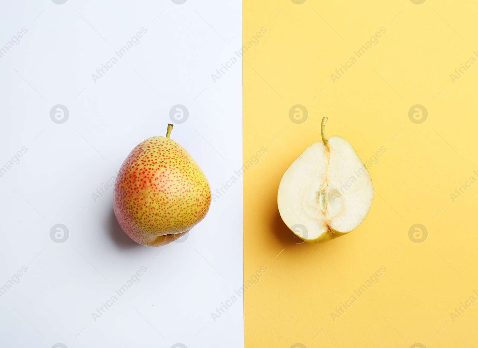 Photo of Ripe juicy pears on color background, flat lay