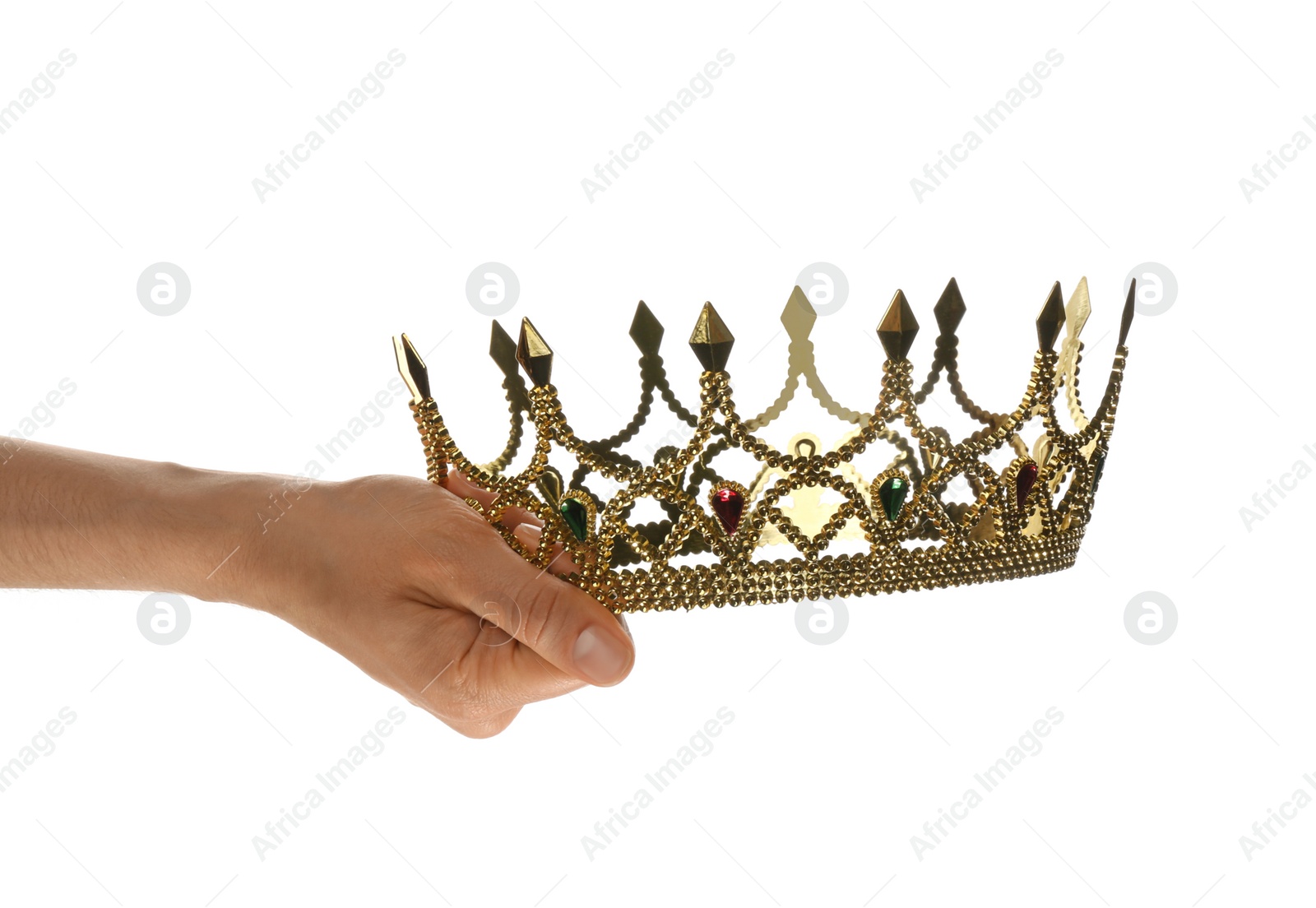 Photo of Woman holding beautiful golden crown on white background, closeup. Fantasy item