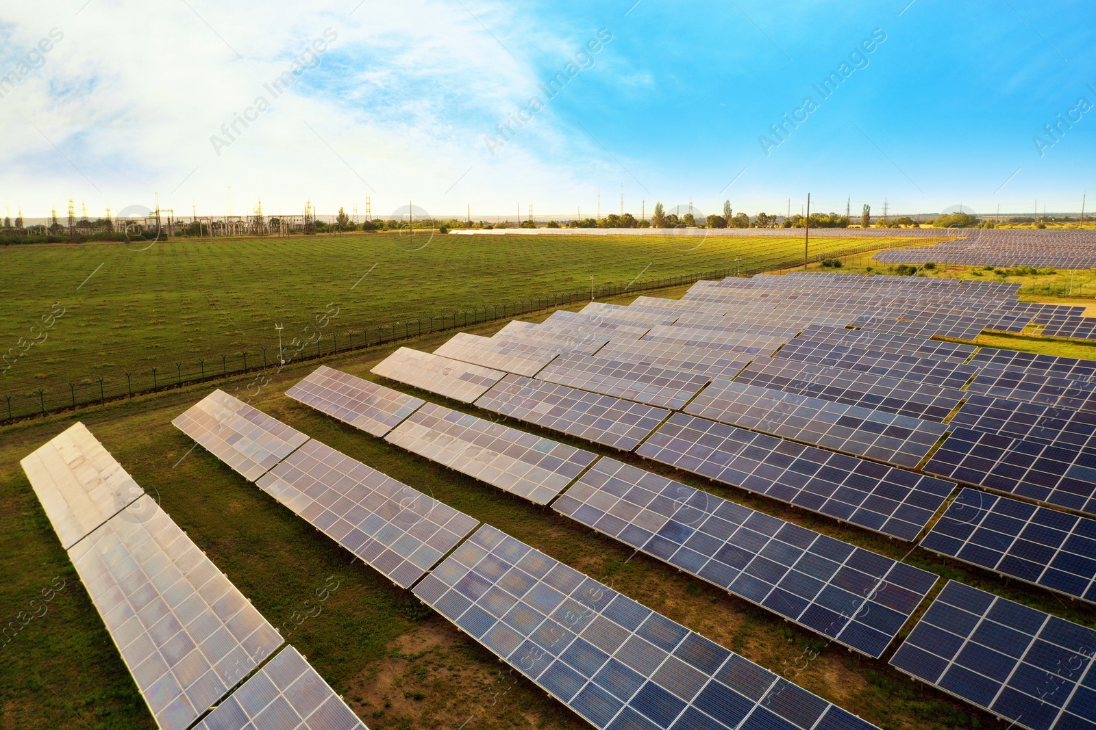 Photo of Solar panels installed outdoors, aerial view. Alternative energy source