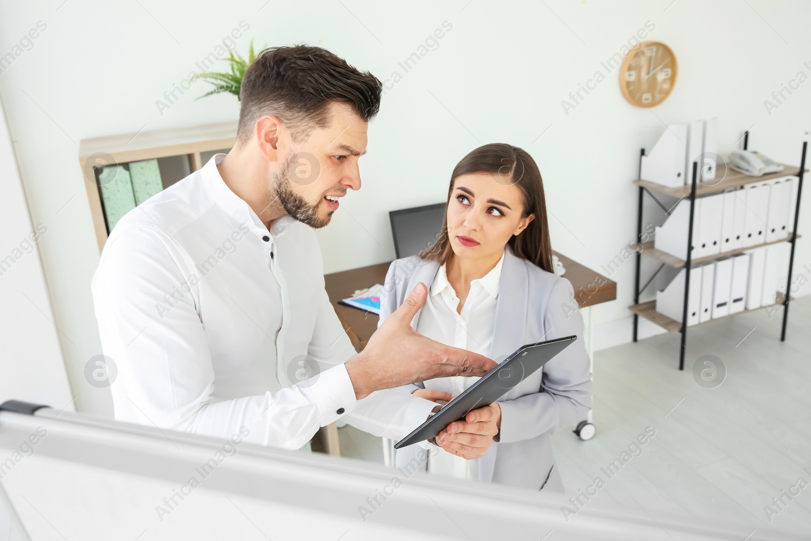 Photo of Office employees having argument at workplace