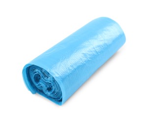 Photo of Roll of light blue garbage bags isolated on white