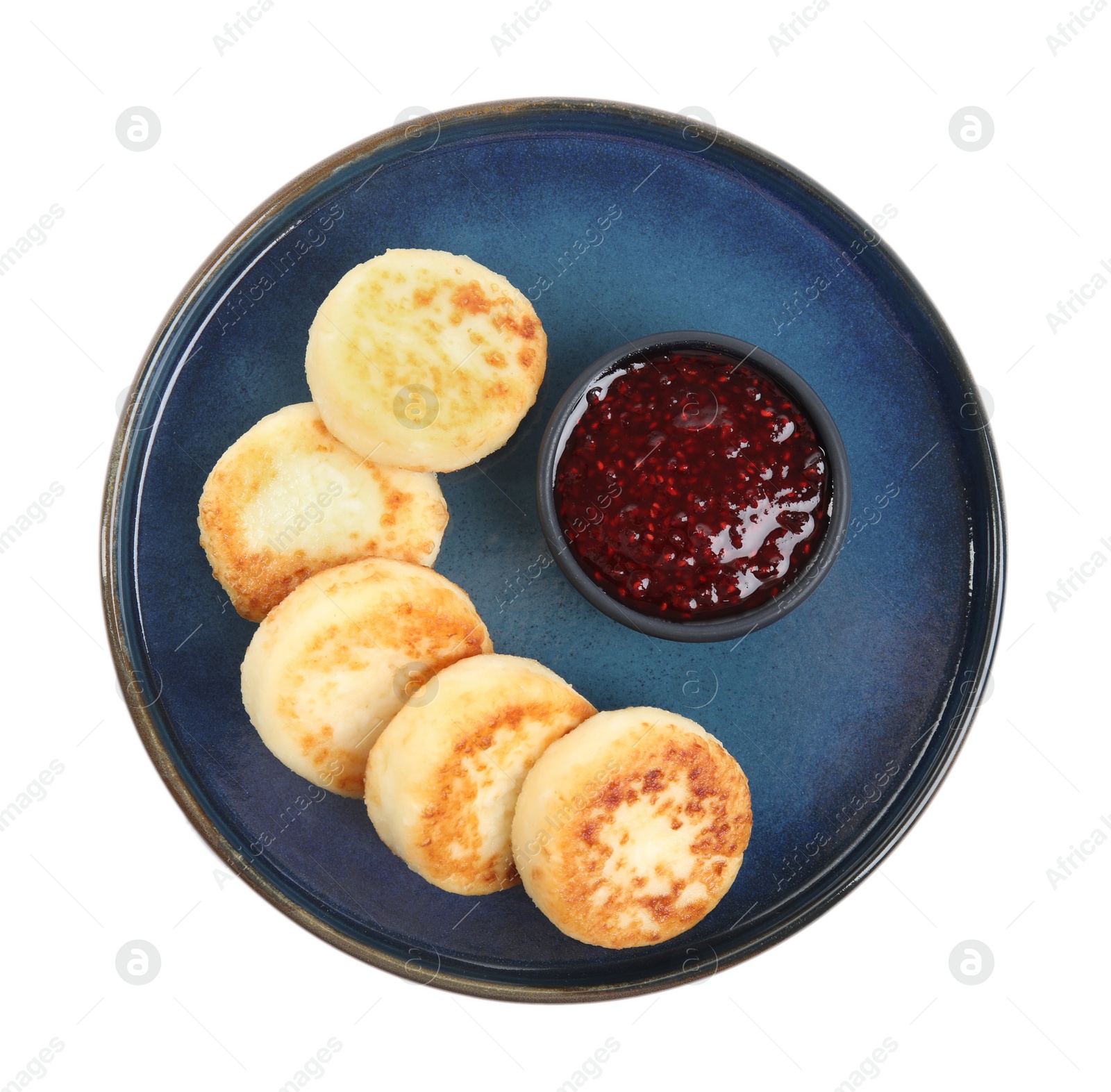 Photo of Delicious cottage cheese pancakes with jam isolated on white, top view
