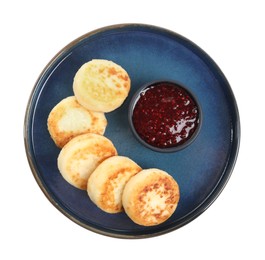 Delicious cottage cheese pancakes with jam isolated on white, top view