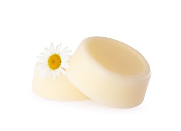 Photo of Solid shampoo bars and chamomile on white background. Hair care