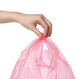 Woman holding pink plastic bag on white background, closeup