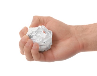 Photo of Man crumpling paper against white background, closeup. Generating idea