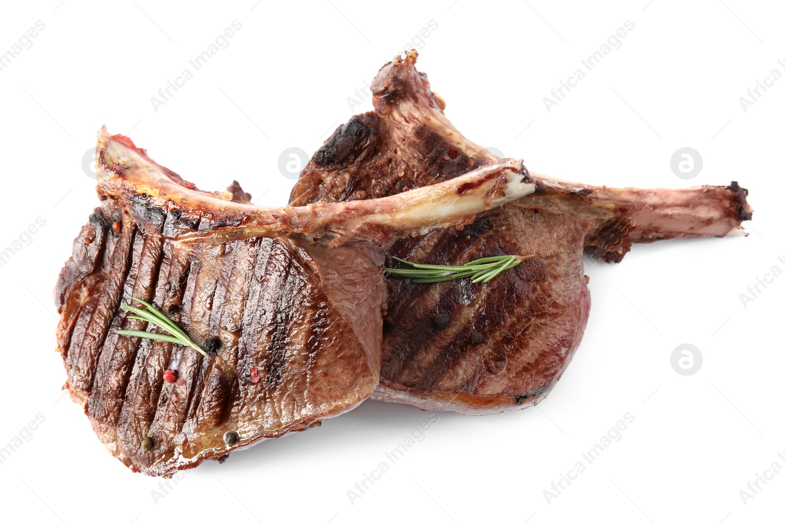 Photo of Delicious grilled beef steaks with rosemary isolated on white, top view