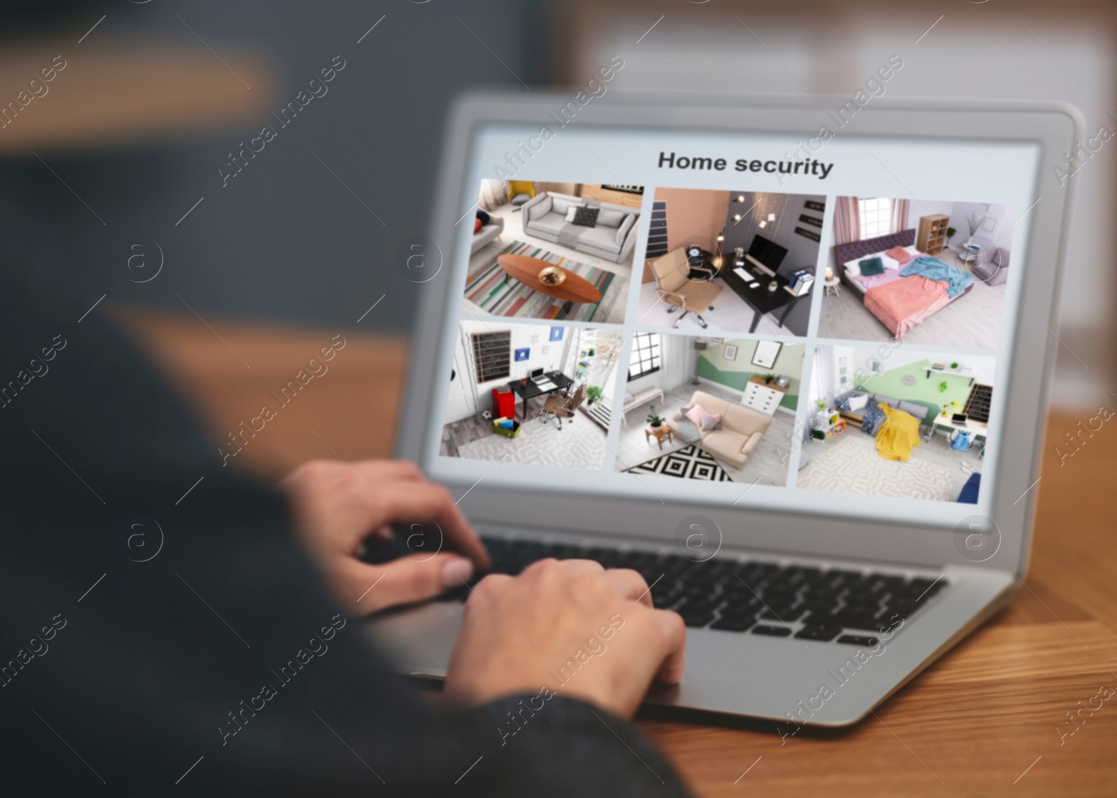 Image of Woman monitoring CCTV cameras at table, closeup. Smart home security system