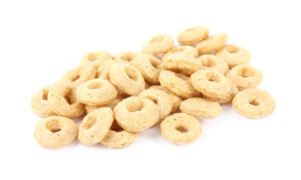 Photo of Pile of tasty corn rings on white background. Healthy breakfast cereal