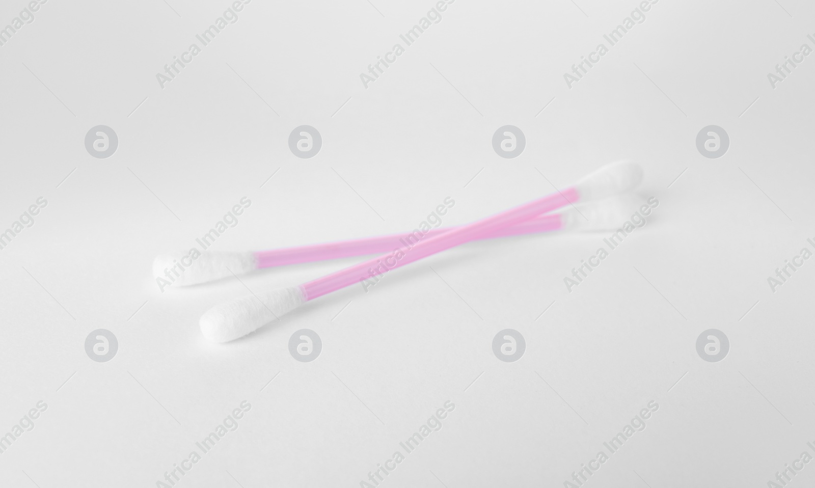 Photo of Clean cotton buds isolated on white. Hygienic product