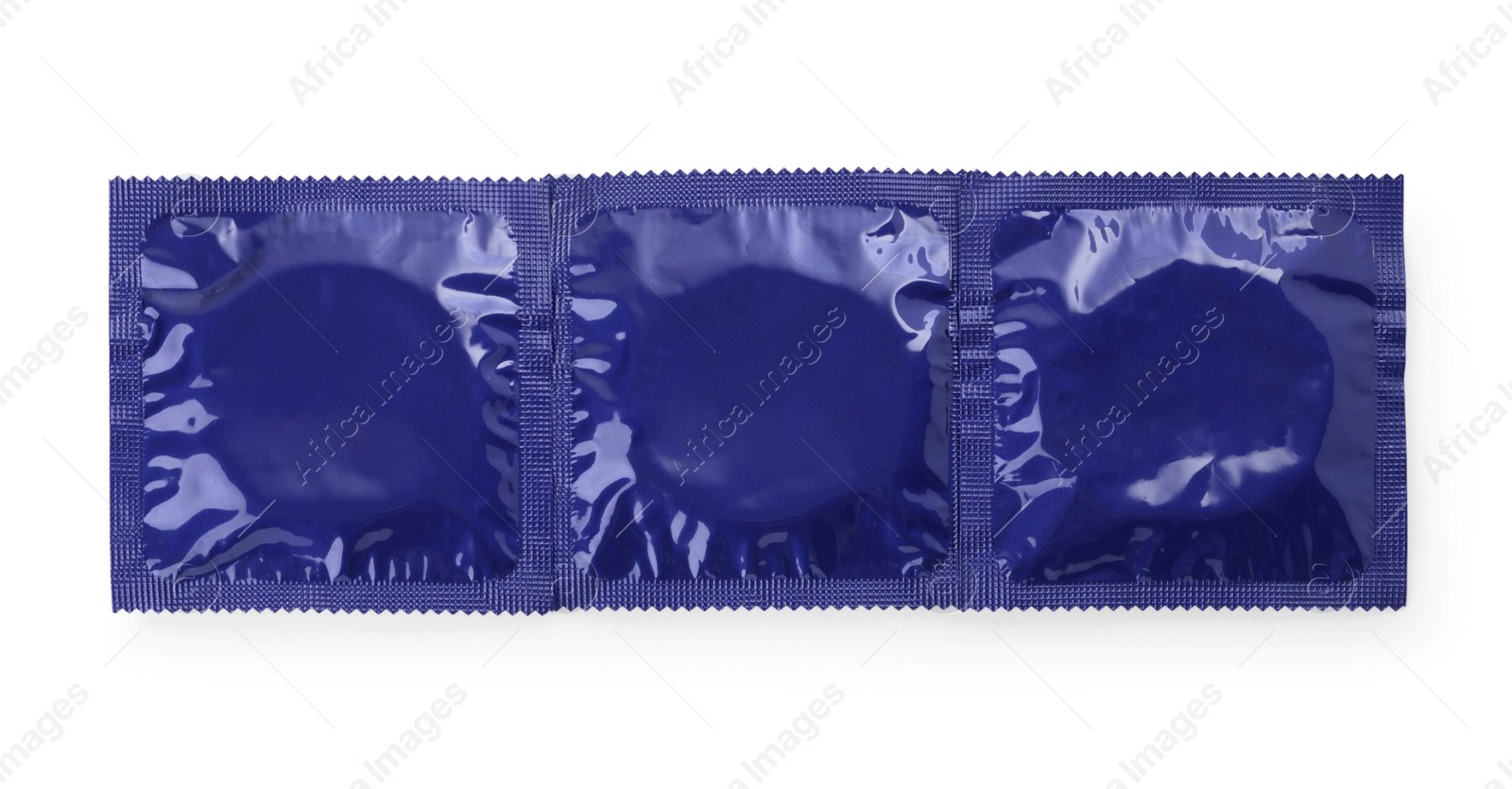 Photo of Packaged condoms on white background, top view. Safe sex