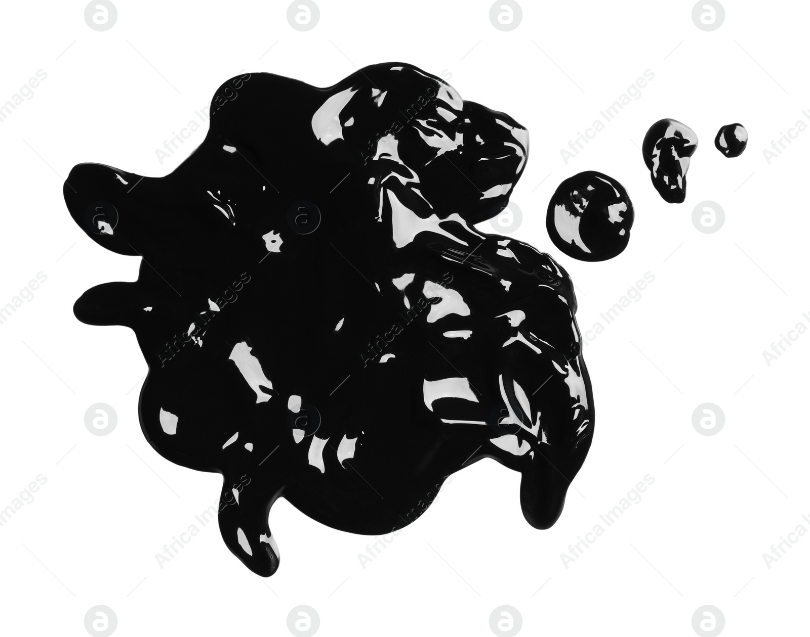 Photo of Blots of black glossy paint on white background