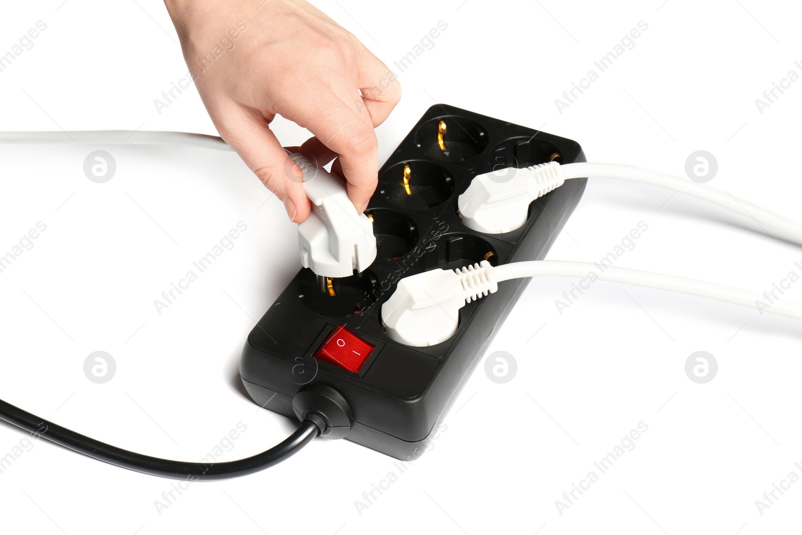 Photo of Woman putting plug into extension cord on white background, closeup. Electrician's equipment