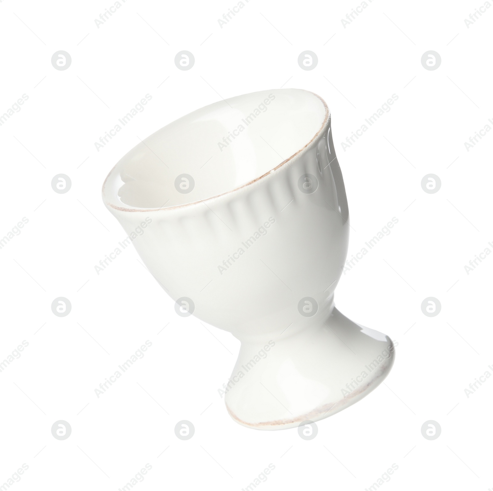 Photo of Clean empty ceramic egg cup isolated on white