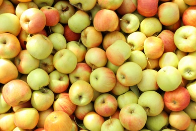 Photo of Fresh ripe apples as background, top view