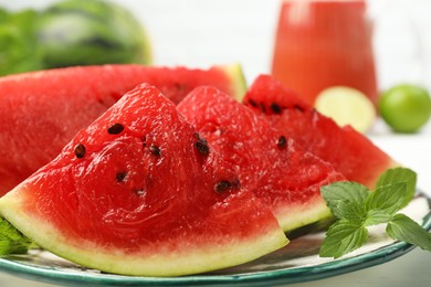 Photo of Slices of juicy watermelon on plate, closeup