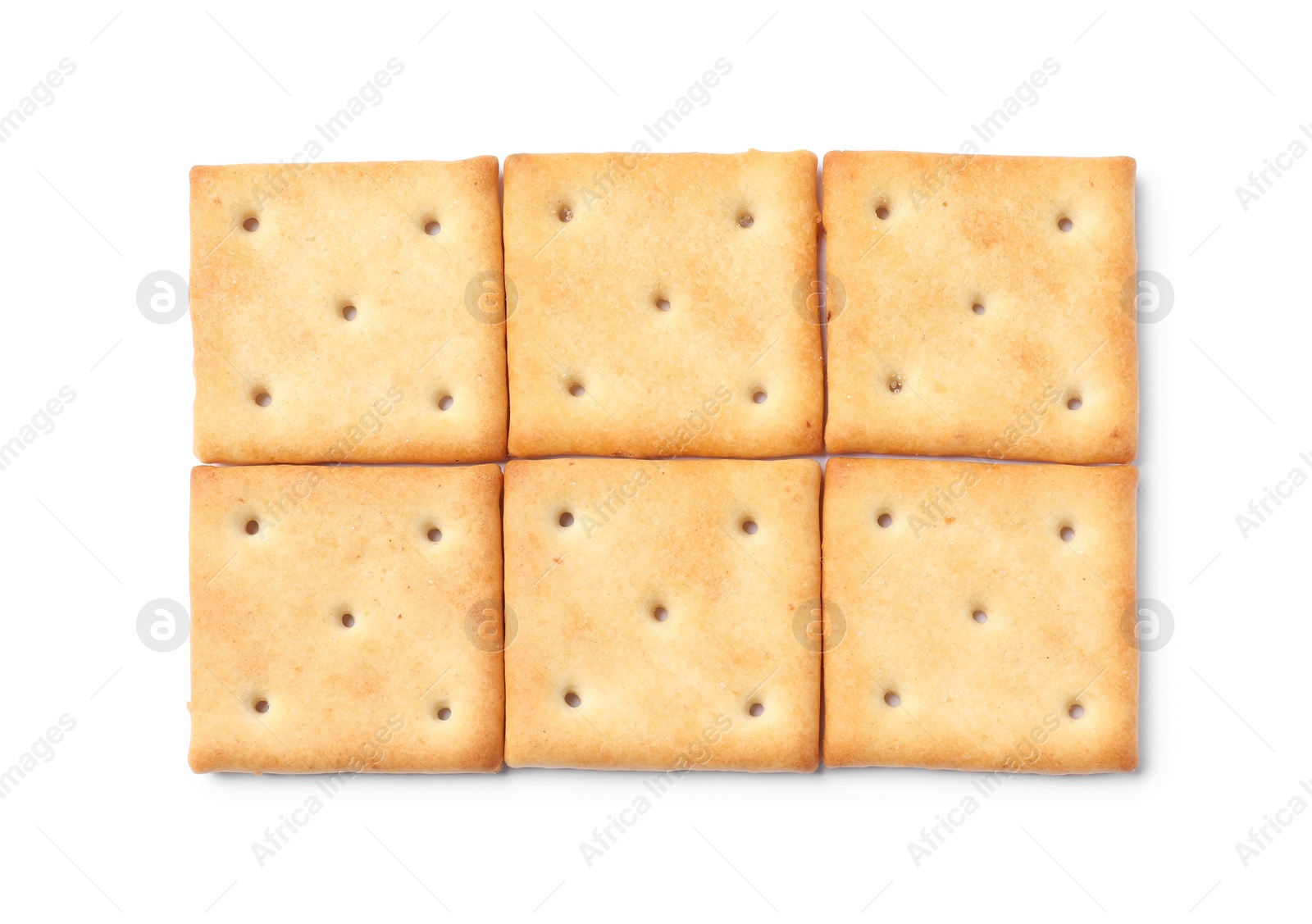 Photo of Tasty crispy square crackers isolated on white, top view