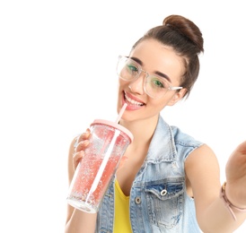 Photo of Young beautiful woman taking selfie against white background