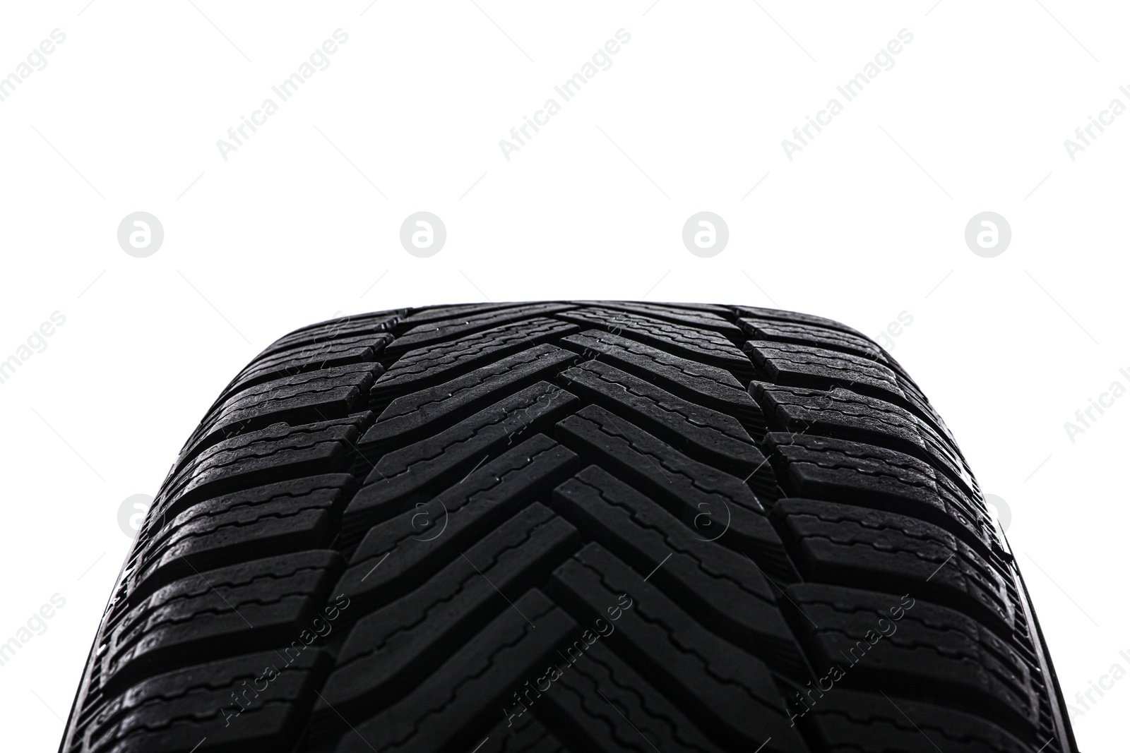 Photo of Winter tire on white background, closeup. Car maintenance