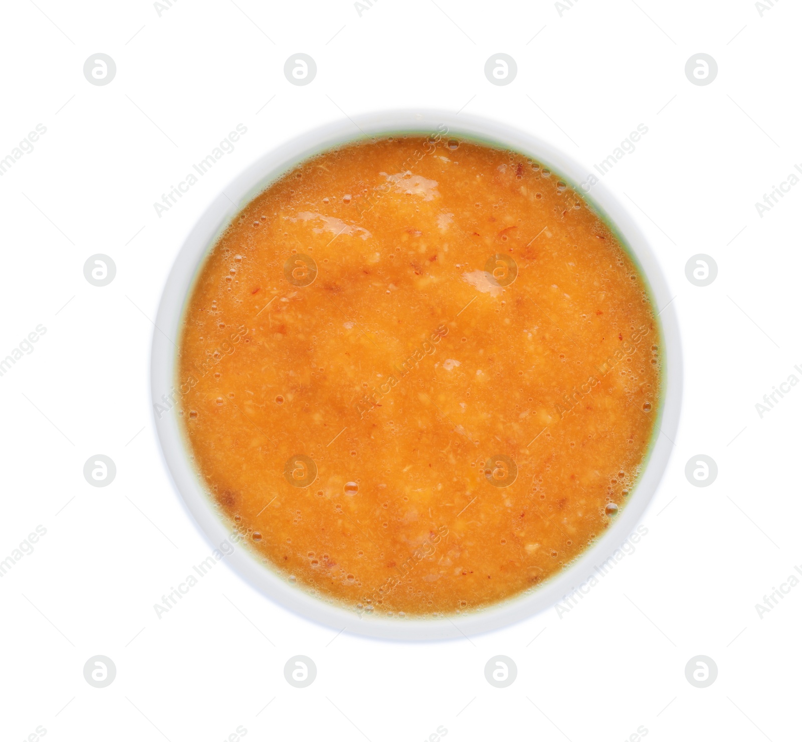 Photo of Fruit puree in bowl isolated on white, top view