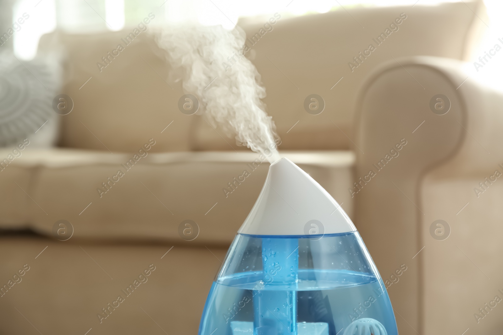 Photo of Modern air humidifier at home, closeup view