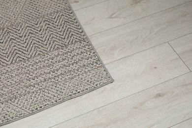 Photo of Soft grey carpet on white laminated floor indoors, space for text