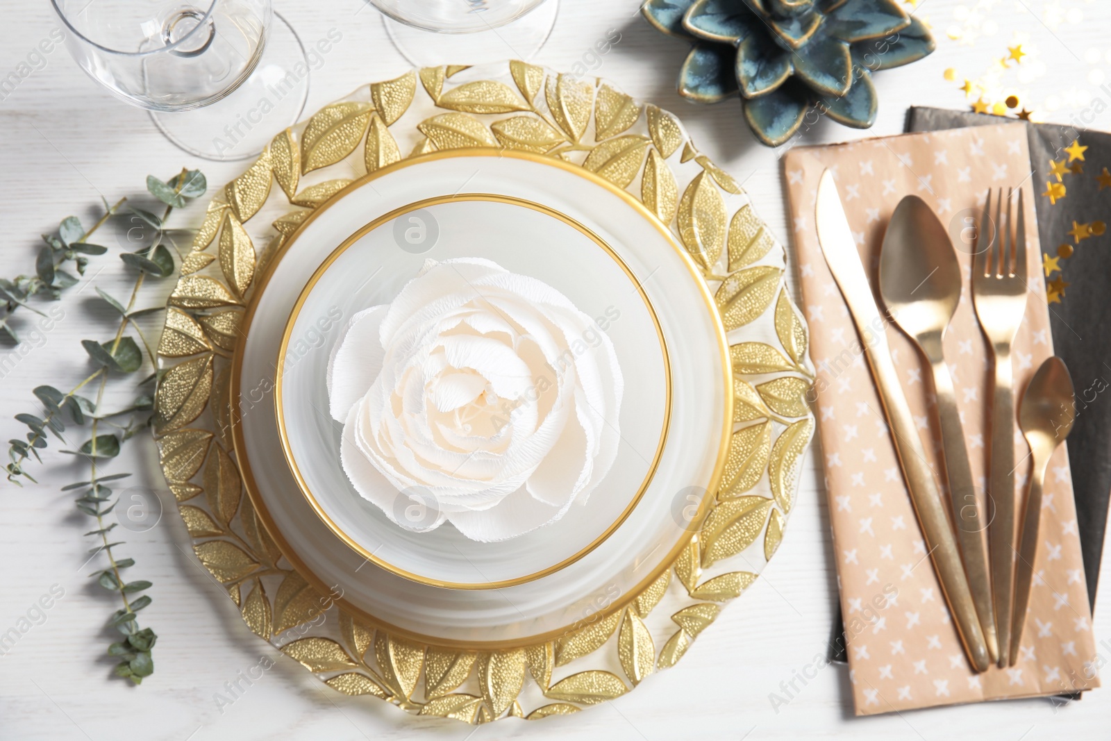 Photo of Elegant table setting on light background, top view