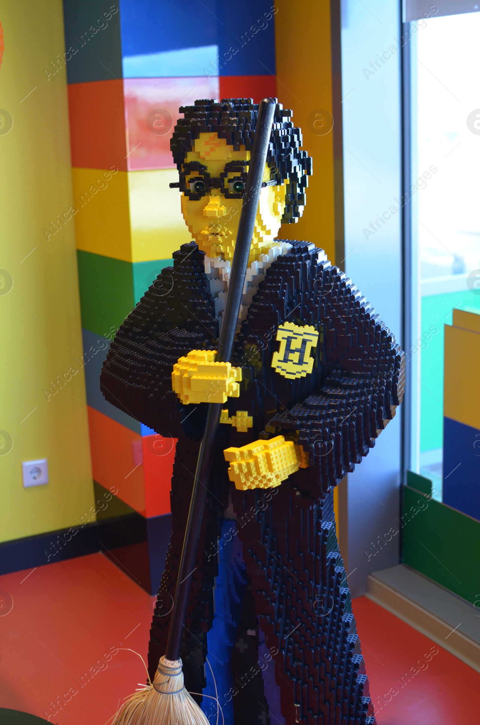Photo of AMSTERDAM, NETHERLANDS - SEPTEMBER 10, 2022: Harry Potter figure made with colorful Lego constructor indoors