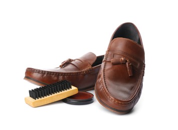 Photo of Stylish footwear and shoe care accessories on white background