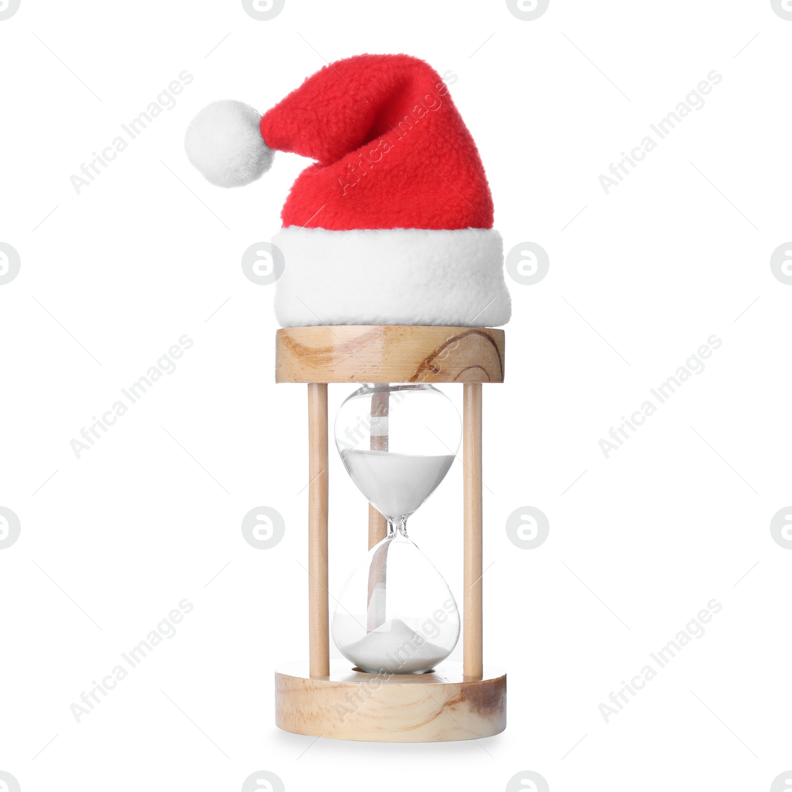 Photo of Hourglass with Santa hat on white background. Christmas countdown