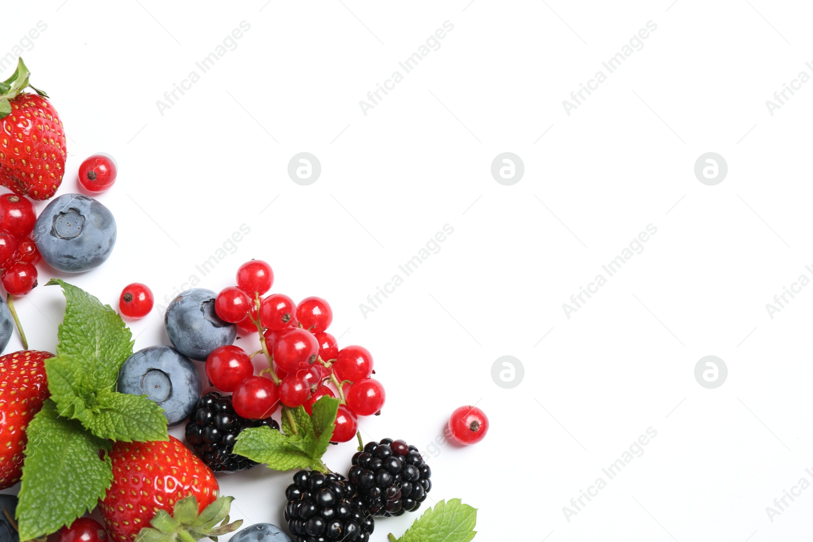 Photo of Mix of fresh berries on white background, flat lay