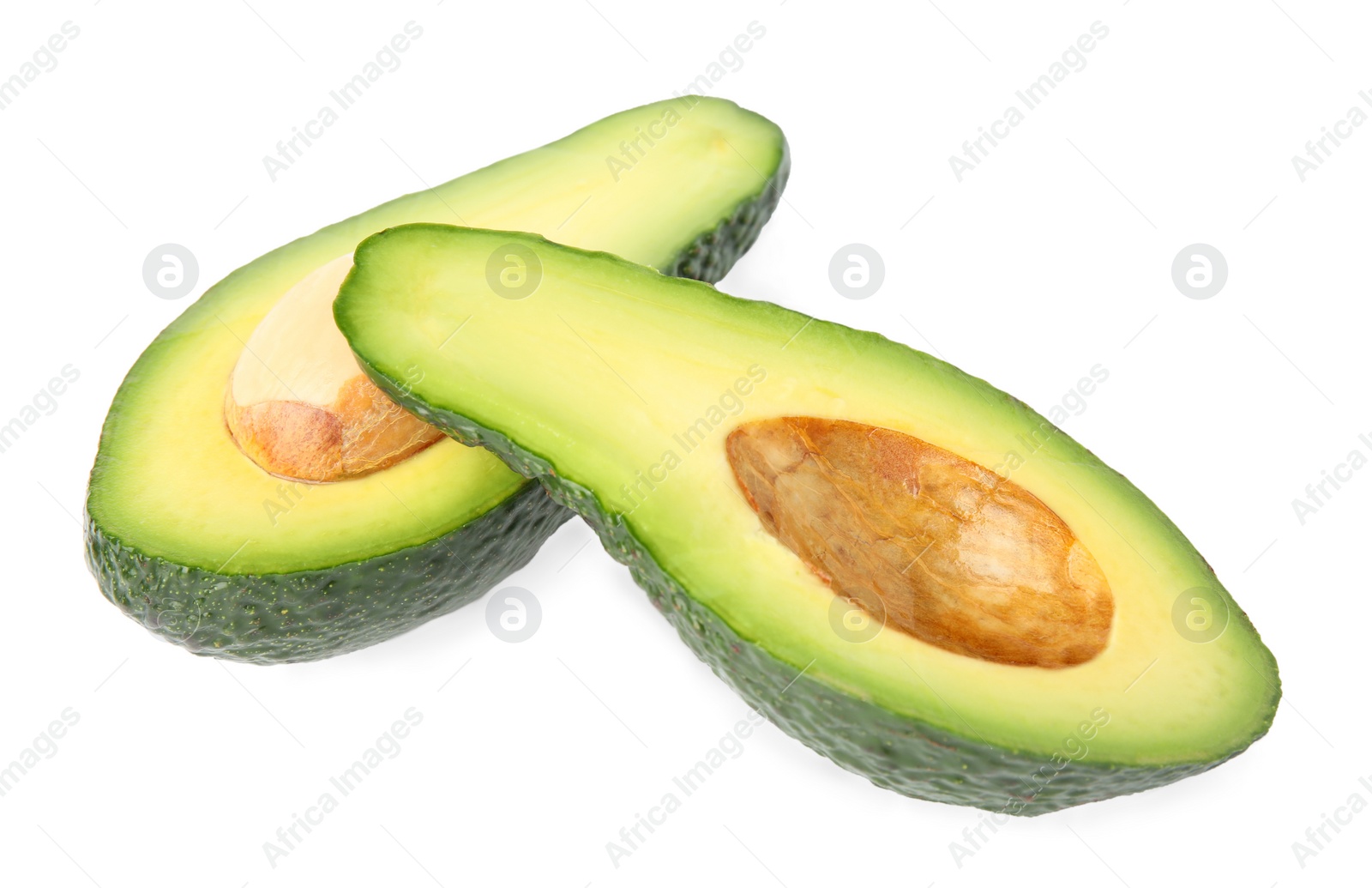 Photo of Cut tasty ripe avocados on white background. Tropical fruit