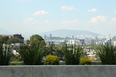 Beautiful view on city and mountains during sunny day