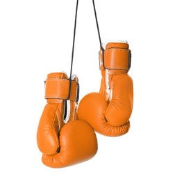 Pair of orange boxing gloves isolated on white