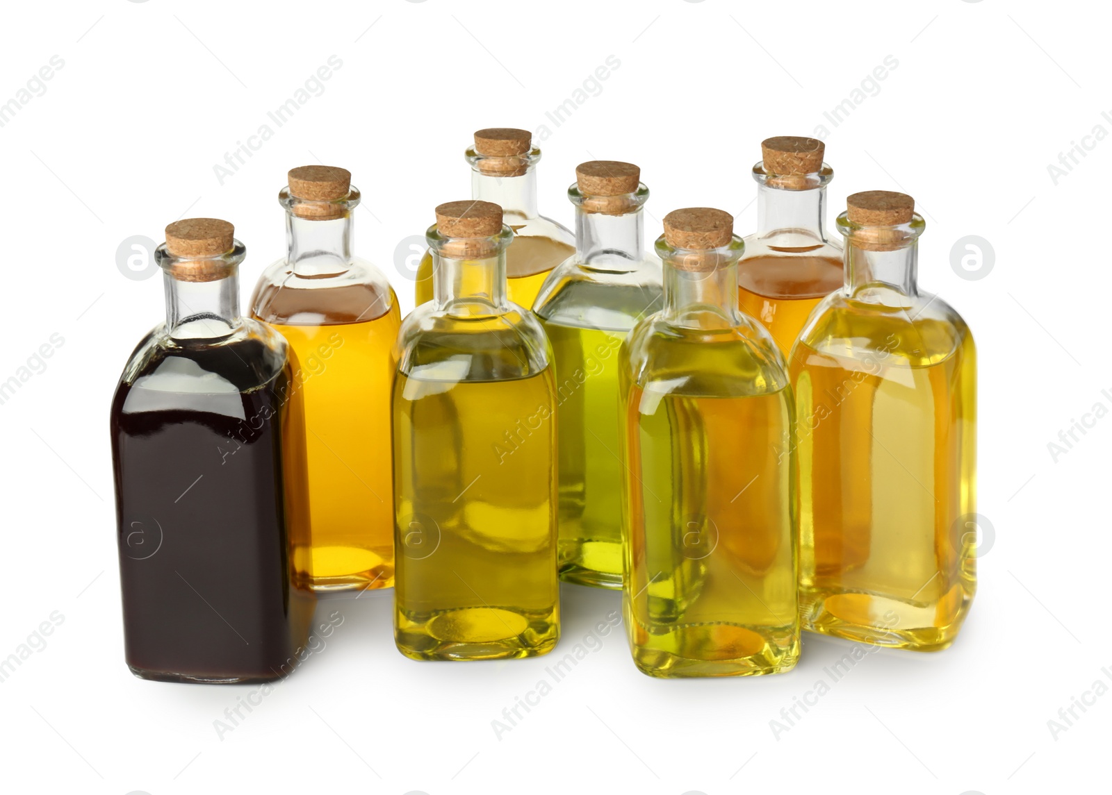Photo of Vegetable fats. Bottles of different cooking oils isolated on white
