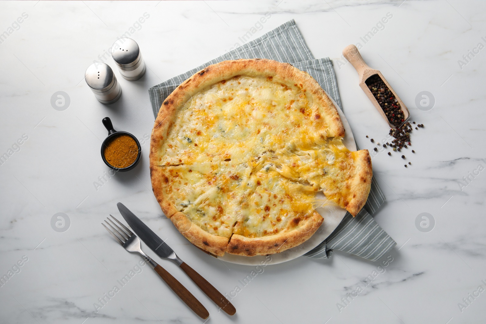 Photo of Delicious cheese pizza served on white marble table, flat lay