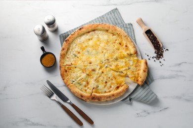 Photo of Delicious cheese pizza served on white marble table, flat lay