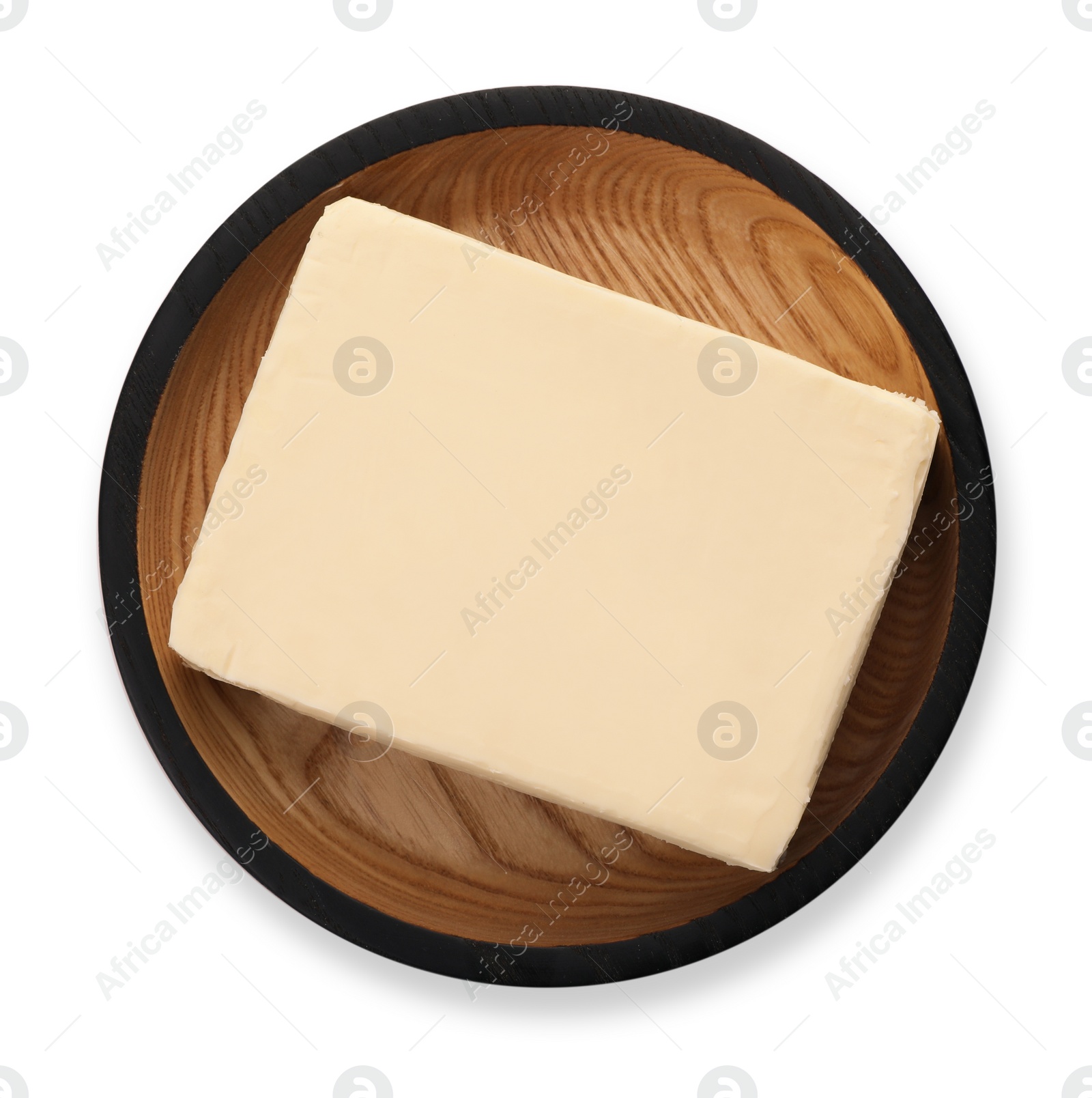 Photo of Wooden plate with tasty fresh butter on white background, top view