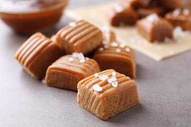 Salted caramel on light grey table, closeup