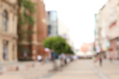 Blurred view of city street on sunny day