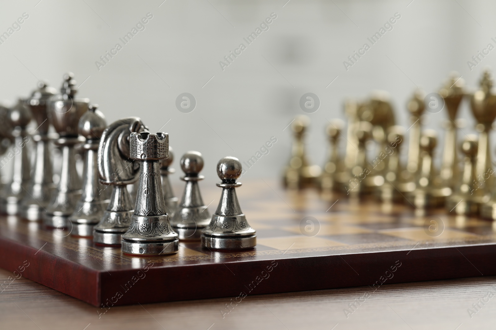 Photo of Set of chess pieces on checkerboard before game, selective focus. Space for text