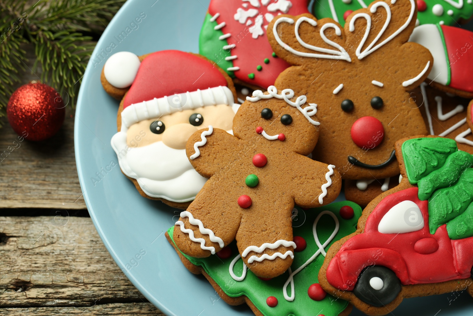 Photo of Different tasty Christmas cookies and decor on wooden table, above view. Space for text